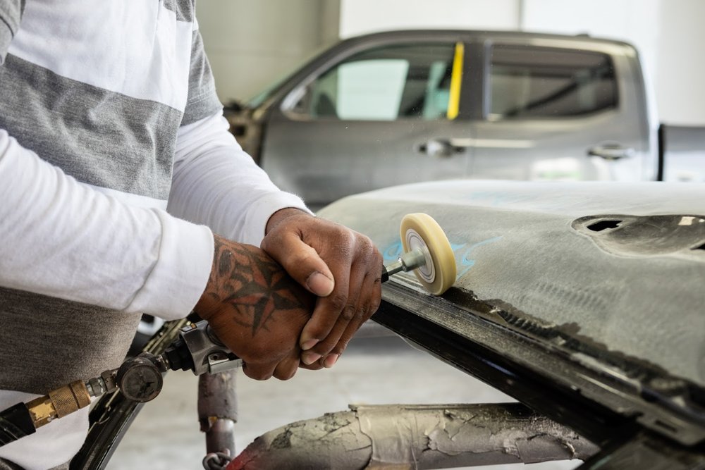 Paint refinishing in the spray booth at Royal Collision Center, Fontana, CA